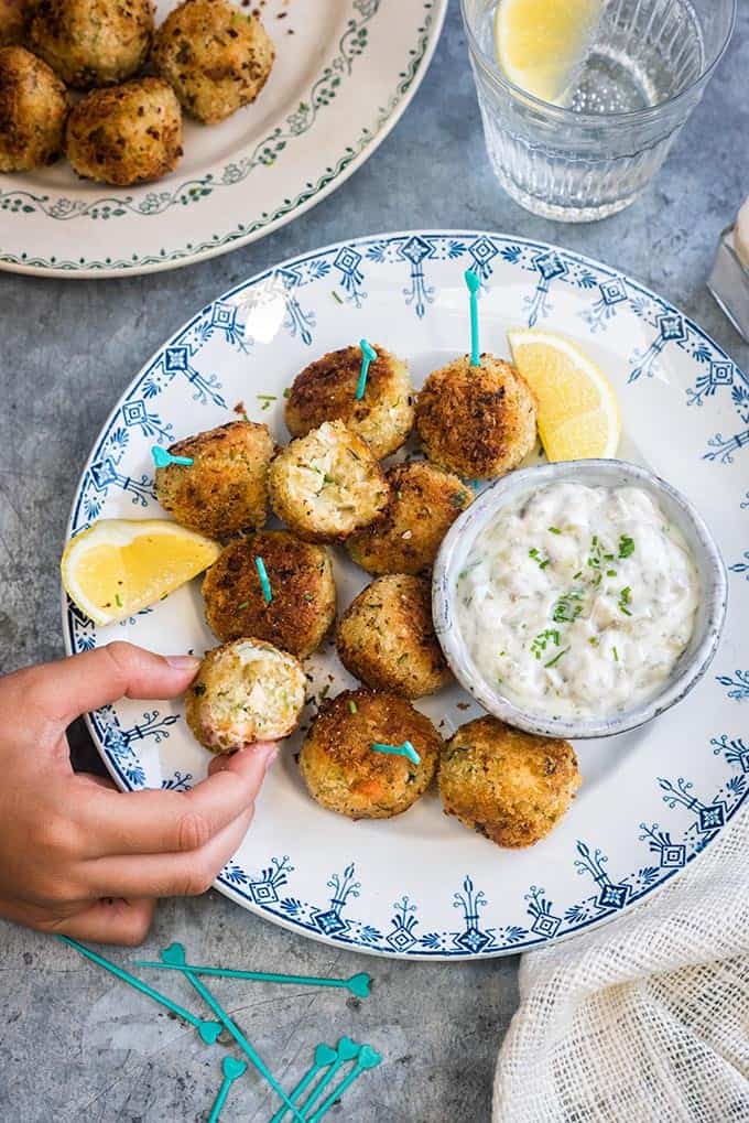 These herby fish croquettes, made with cod, haddock and salmon, are delicious served with easy tartar sauce. Kids and adults will love them! | Supergolden Bakes