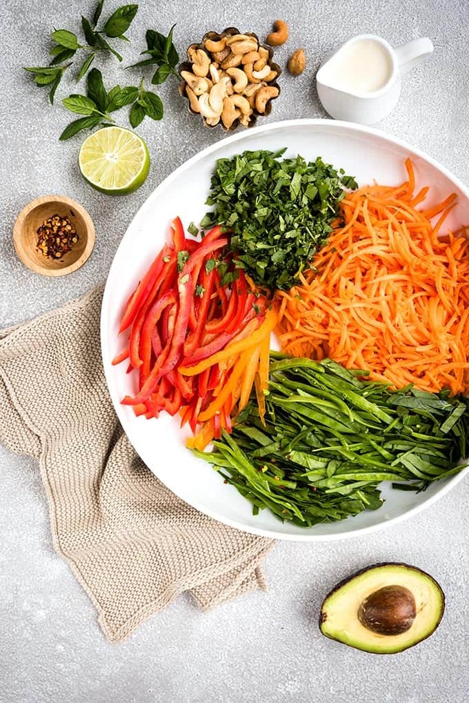Meet my crunchy rainbow Thai salad! This is seriously tasty and absolutely PACKED with vegetables. We are talking carrots, spinach, peppers, mange tout, cucumber, avocado, tons of herbs and the most addictive Thai salad dressing.