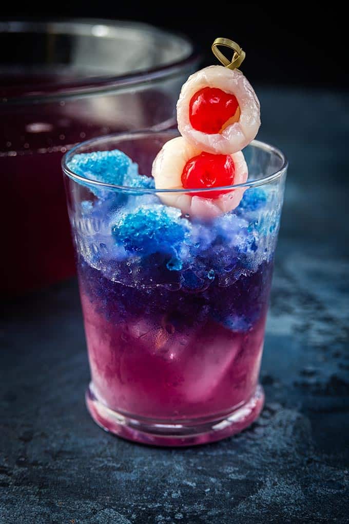 Color changing Halloween cocktail decorated with lychee eyeballs