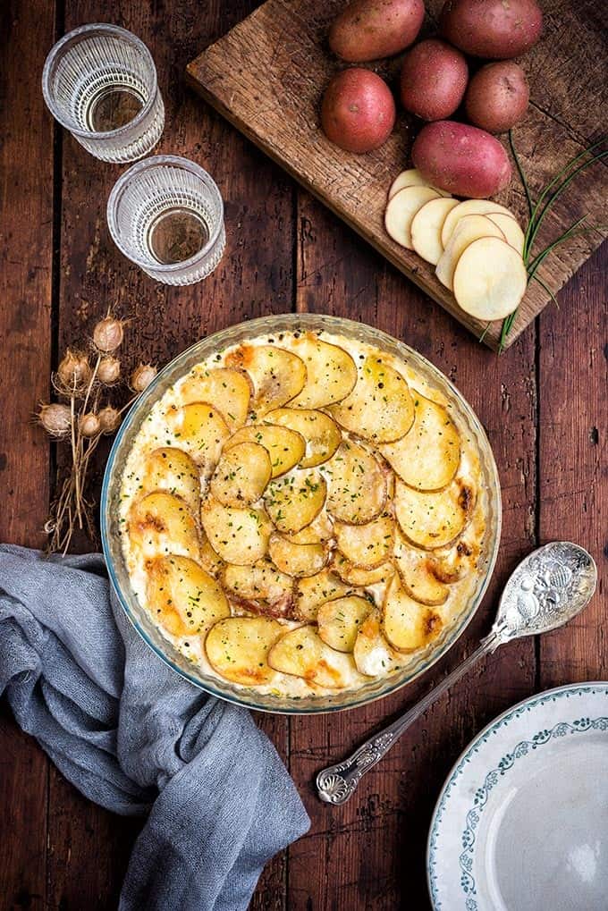 These creamy scalloped potatoes with Parmesan and bacon are the ultimate comfort food. Serve as a Thanksgiving or Christmas side dish | Supergolden Bakes #scallopedpotatoes #Thanksgiving #Christmas