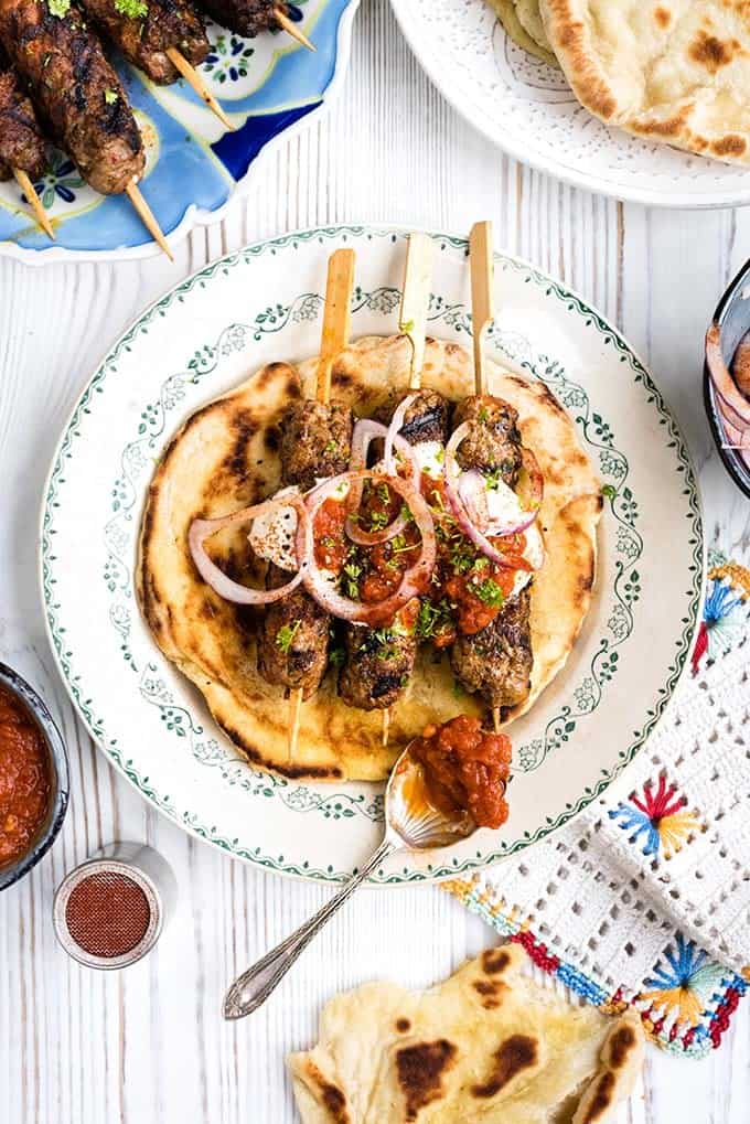 If you are not familiar with lamb giaortlou kebab, you are really in for a treat! Spiced lamb kofta served over warm pitta bread with tomato sauce and yoghurt. 
