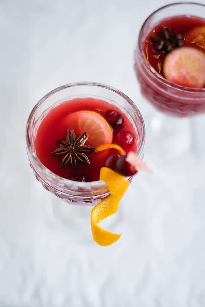 This virgin mulled cranberry punch is perfect for the holidays! Made with cranberry juice plus citrus and seasonal spices, it is best enjoyed warm.