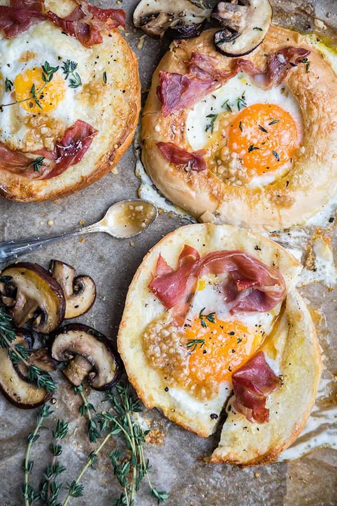 Eggs-in-a-basket or eggs-in-a-hole? Whatever you want to call these sheet-pan baked eggs-in-a-bagel-hole, they are immensely delicious!