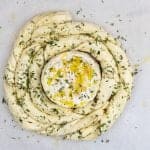Puff pastry spiral with baked camembert, honey, rosemary and thyme, ready for the oven