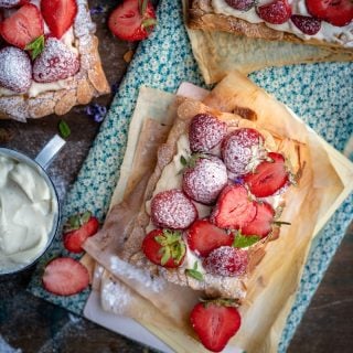 Strawberry puff pastry tarts dusted with icing sugar