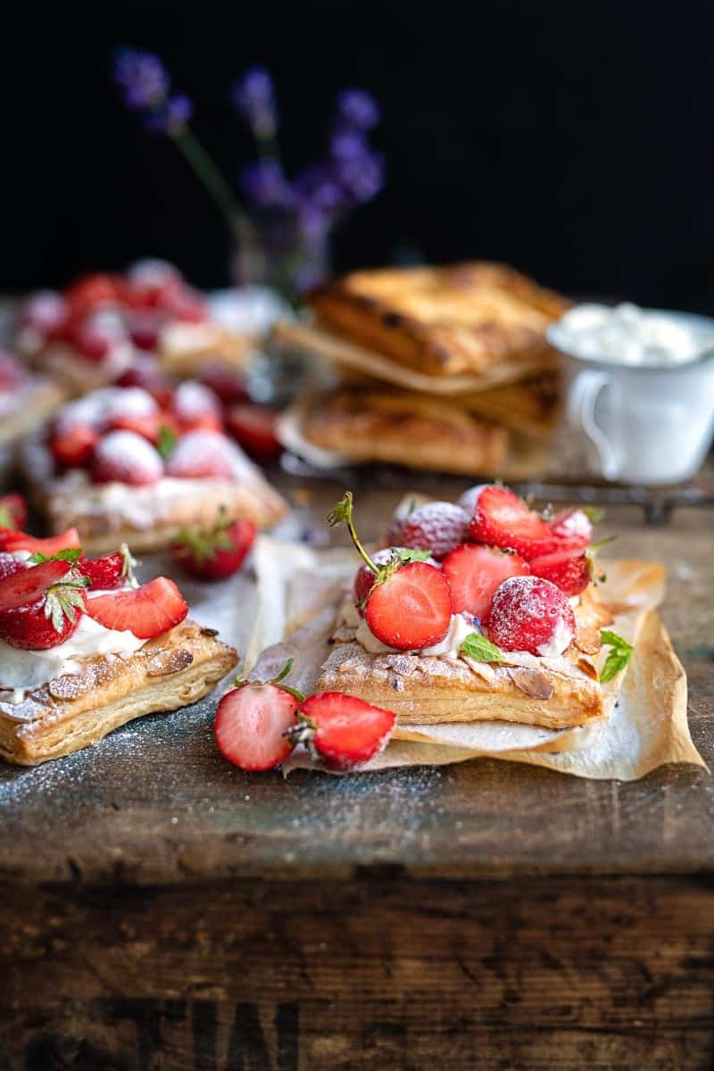 Strawberry puff pastry tarts dusted with icing sugar