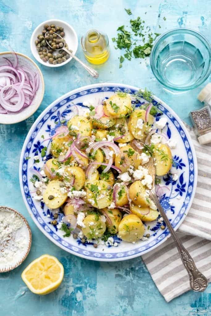 Greek Potato Salad on a blue patterned plate