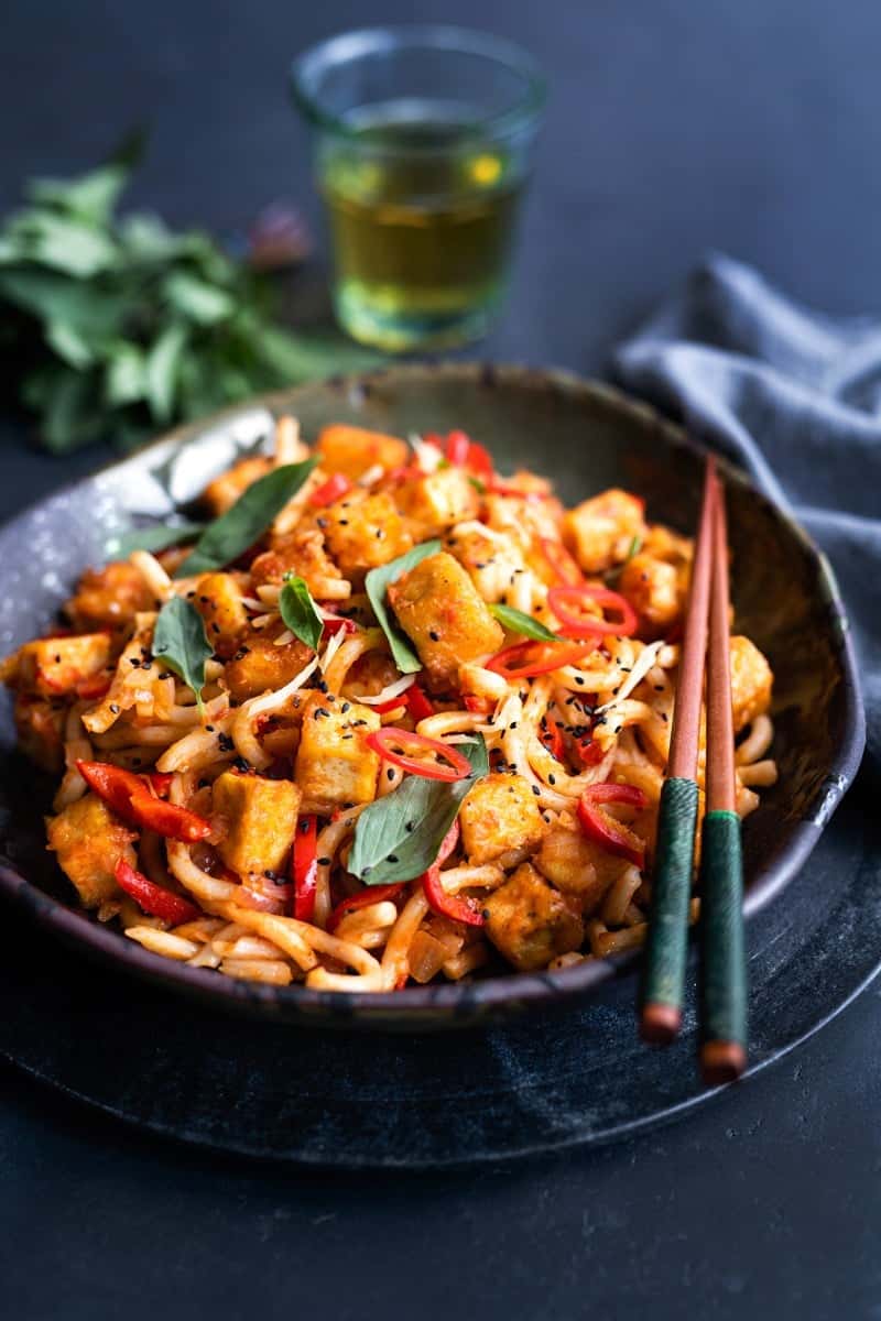 Stir-fried tofu and peppers in tomato & garlic sauce with udon noodles