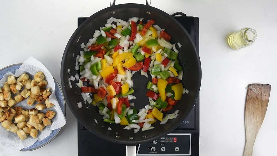 Stir frying onion and peppers