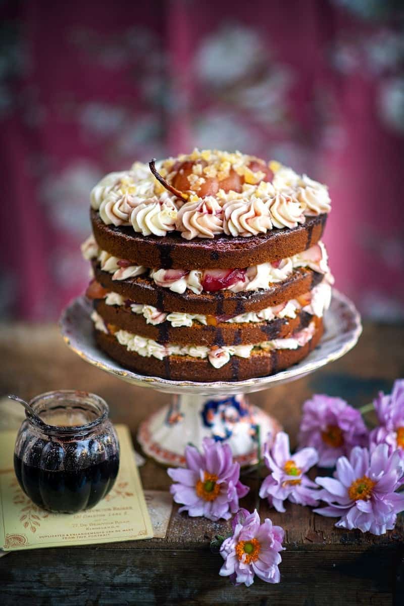 Ginger layer cake topped with wine-poached pears and cream cheese frosting