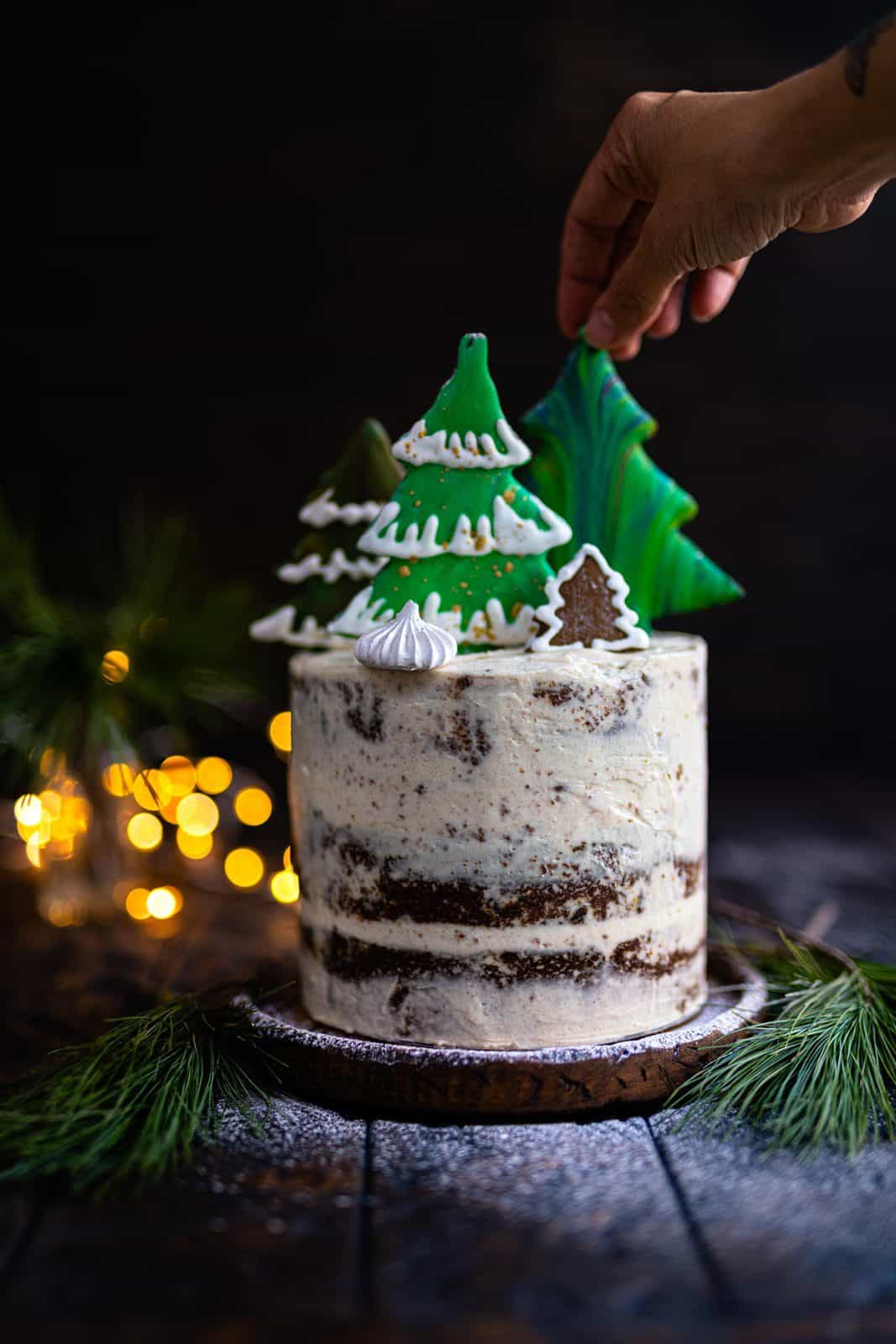 Gingerbread Cake decorated with gingerbread cookies and meringue kisses
