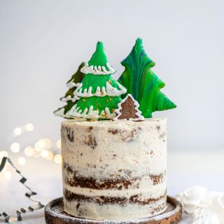 Gingerbread layer cake decorated with gingerbread cookies