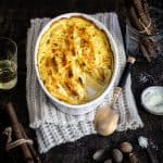 Root vegetable gratin in an oval dish