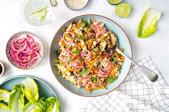 Healthy satay chicken salad with pickled onions