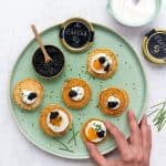 Blini canapés with caviar and sour cream
