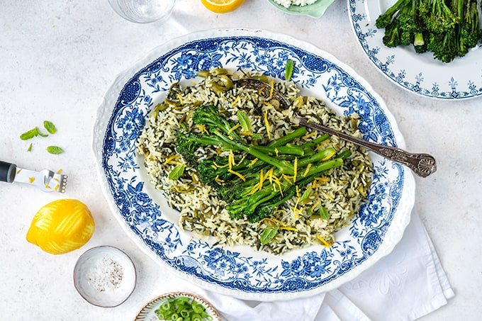 Platter of Greek spinach rice topped with broccoli spears