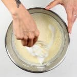 folding whisked egg whites into blini batter