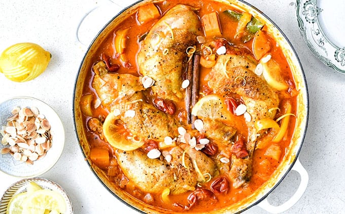 Overhead shot of chicken casserole with squash, apricots and lemons