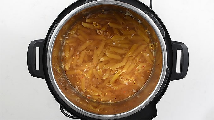 Penne pasta and water in an Instant Pot 