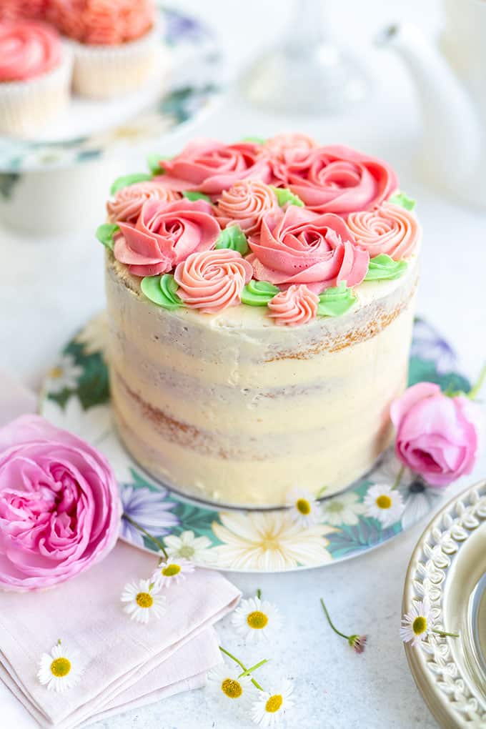 Pink ombre layer cake decorated with pink buttercream roses