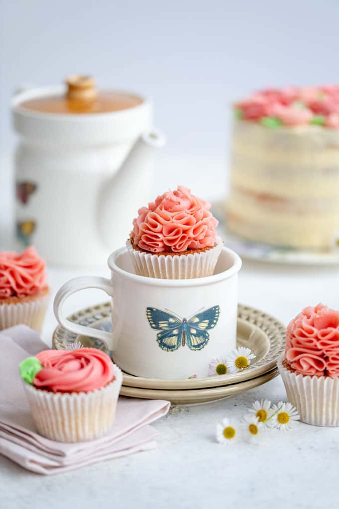 Pretty cupcake with ruffled buttercream frosting in teacup