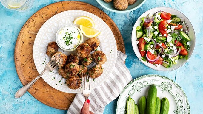 Healthy turkey meatballs served with yoghurt dip and lemon wedges