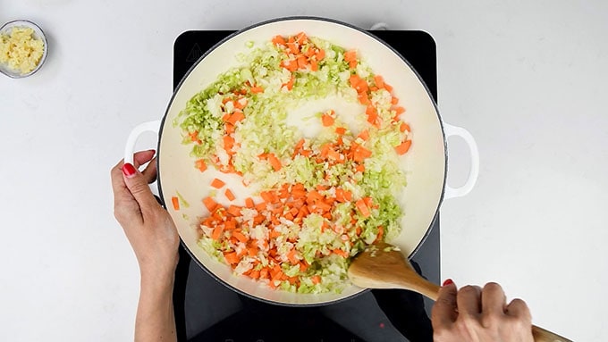 cooking onion, carrots and celery in a casserole