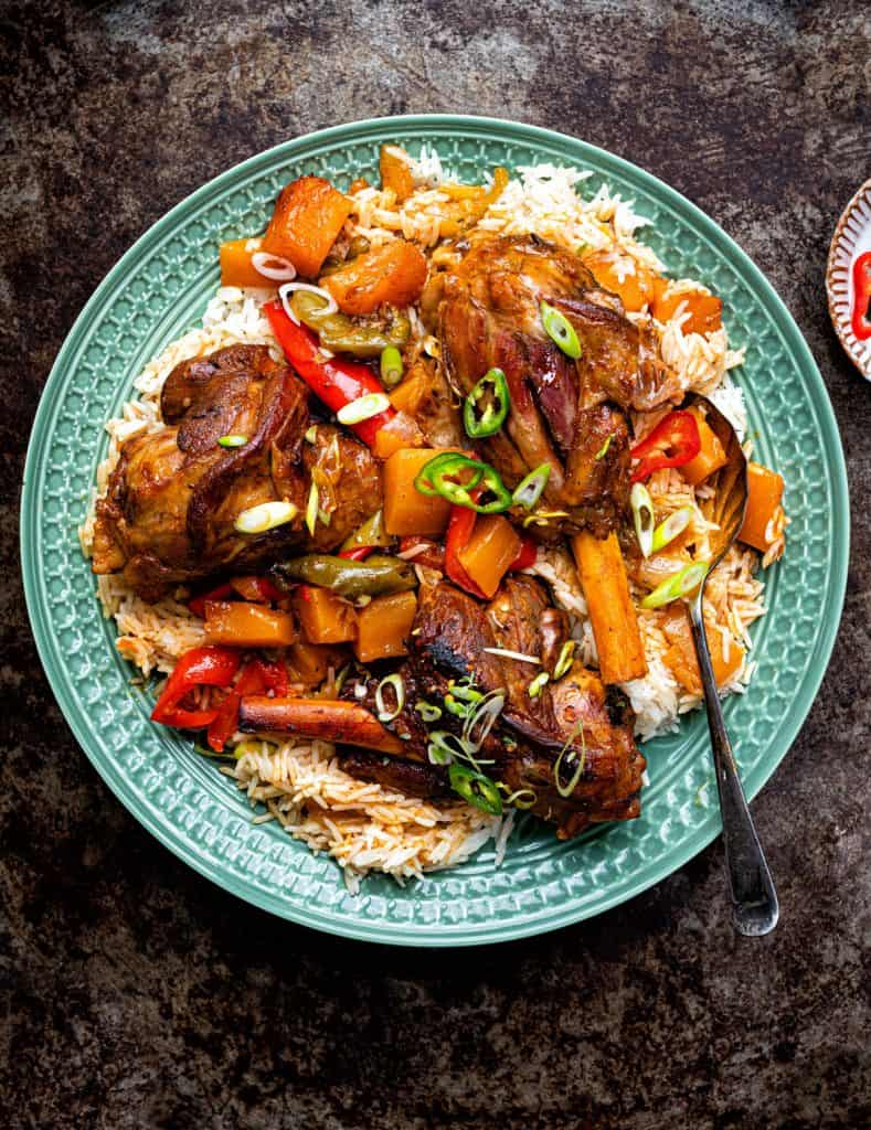 Braised lamb shanks over a bed of coconut rice
