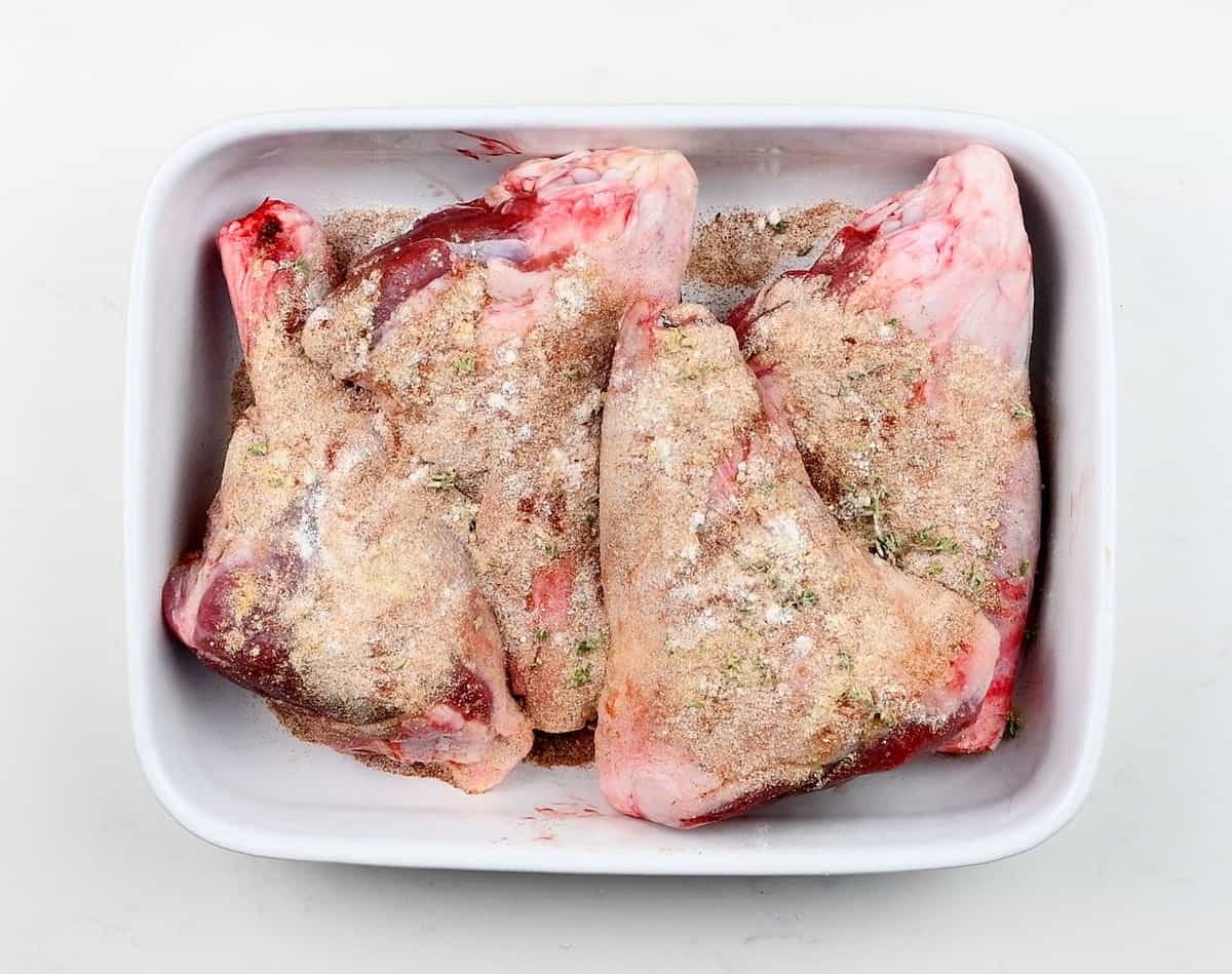 Coating lamb shanks in spices and herbs