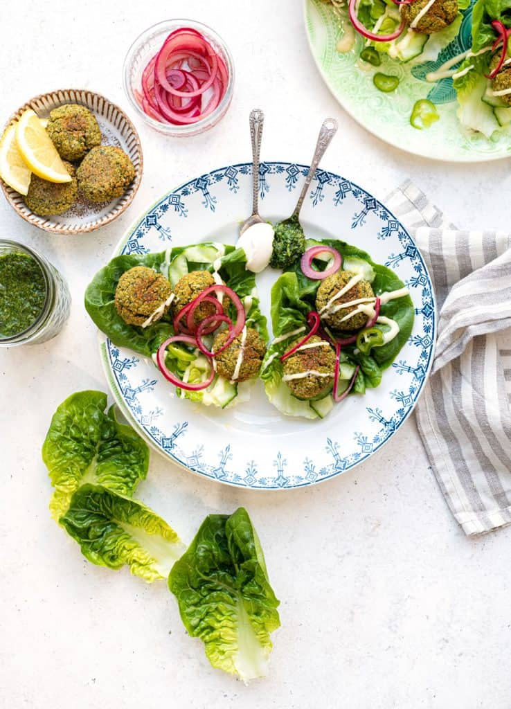 Falafel served in lettuce leaves with pickled onions