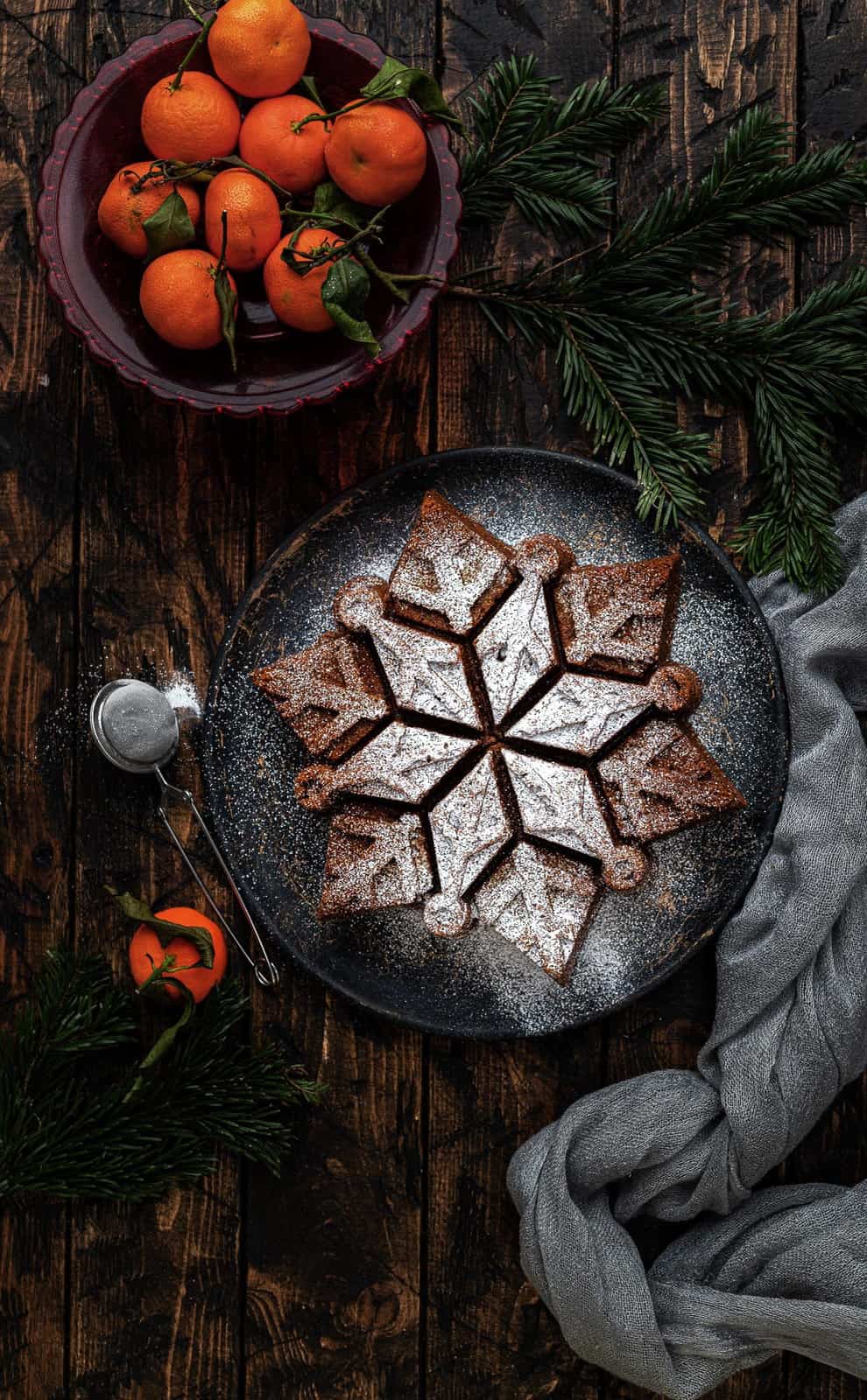 Ginger cake baked in a snowflake cake tin dusted with sugar