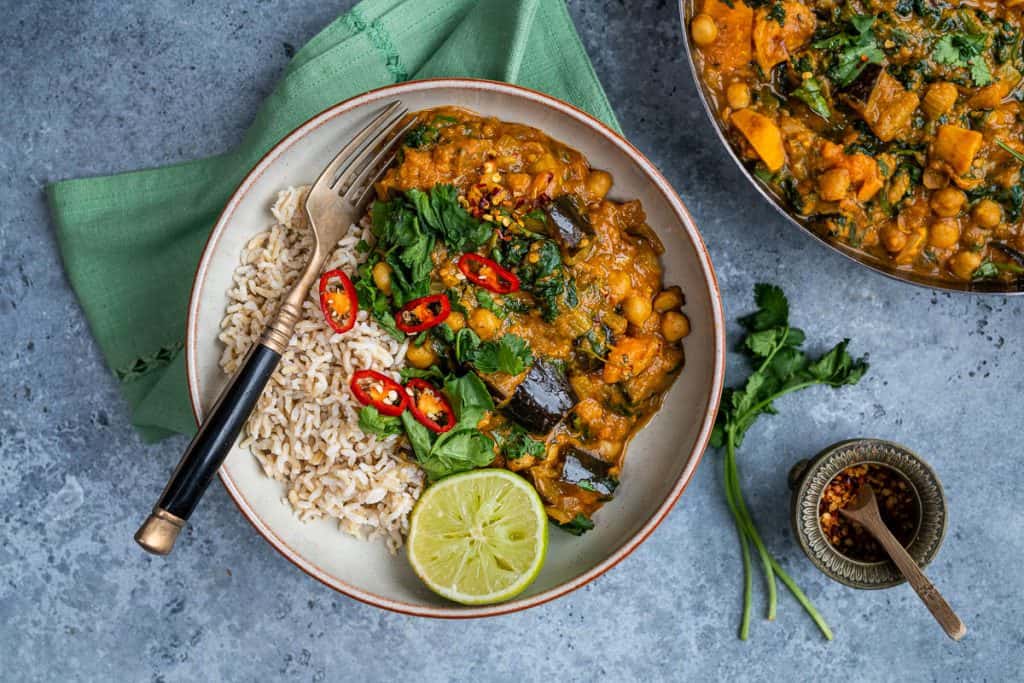 Creamy vegan curry served with rice in a bowl