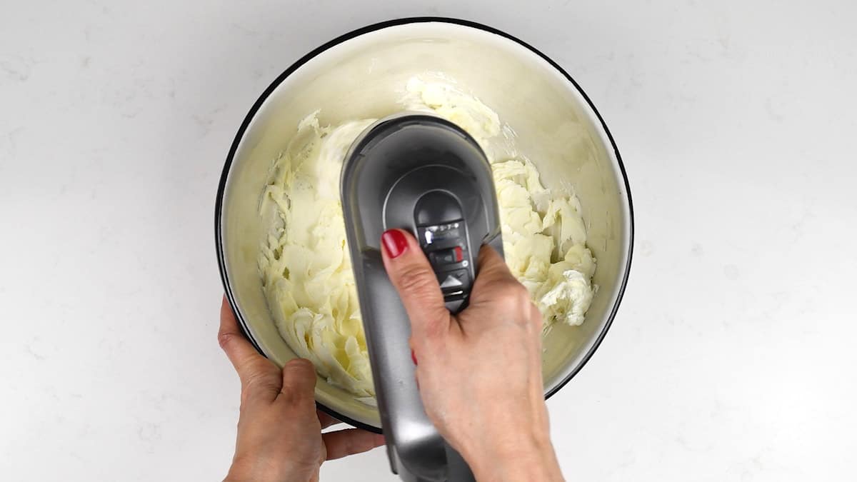 whisking double cream in a bowl