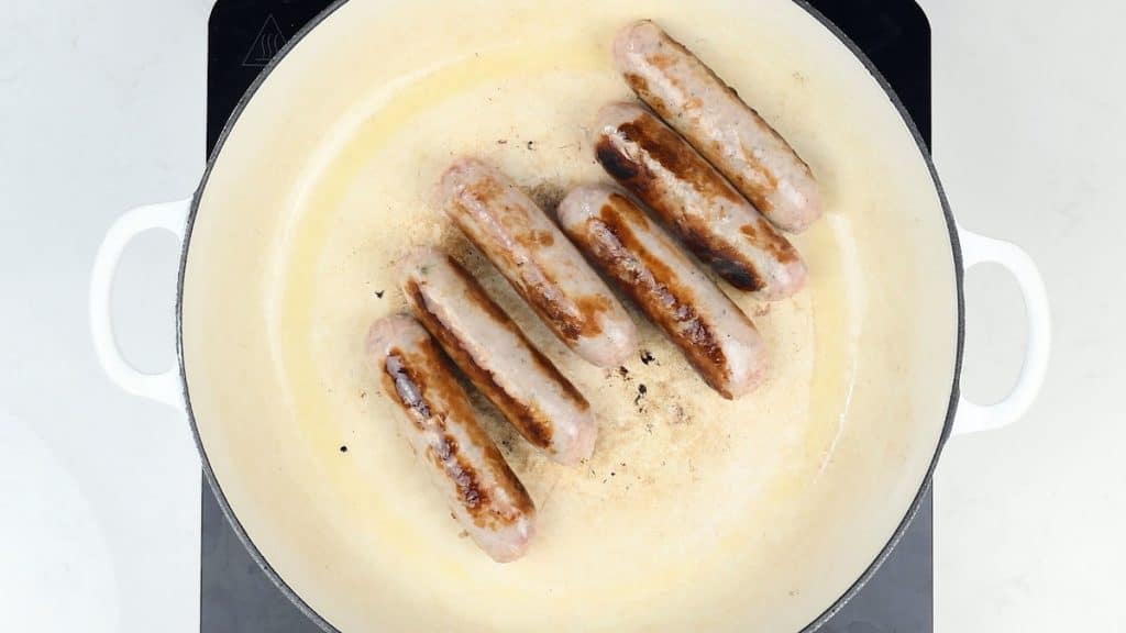 cooking sausages in a casserole dish