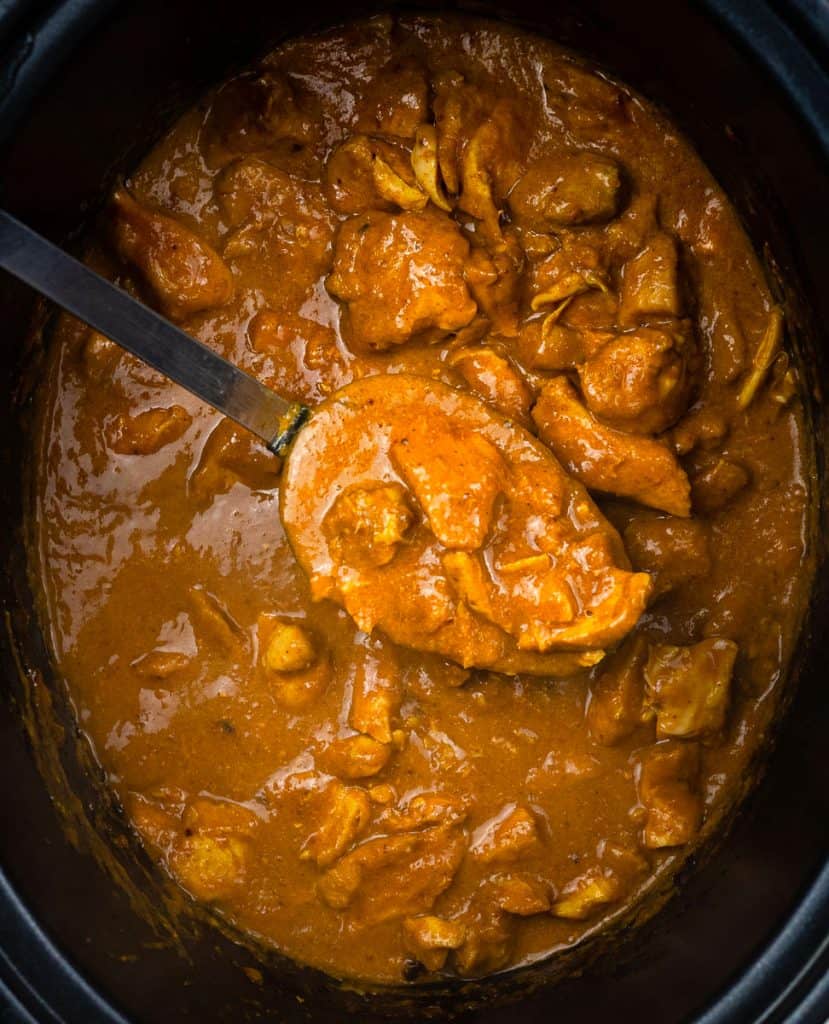 close up on creamy chicken curry in a slow cooker
