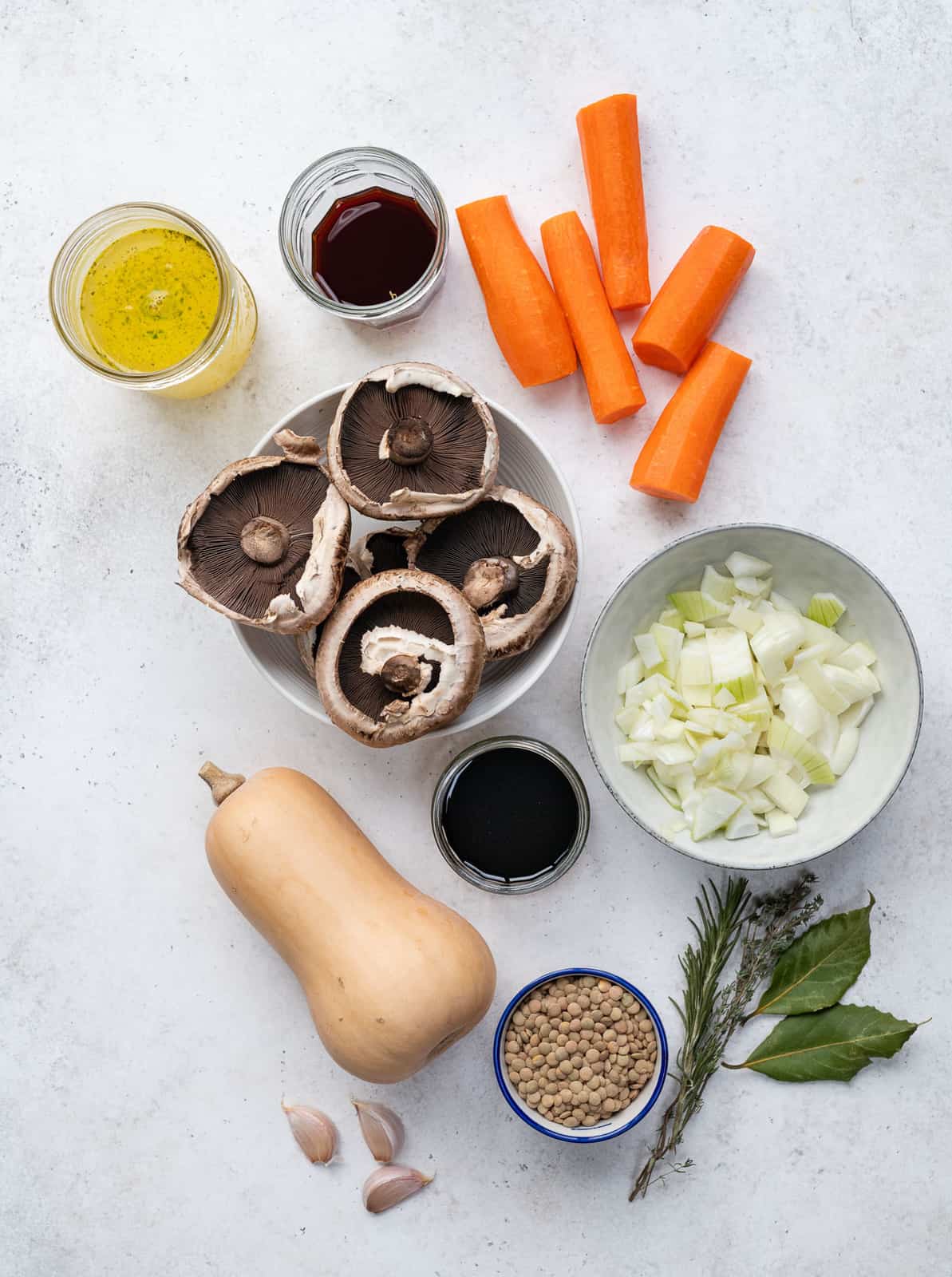 Ingredients for vegan stew against white background