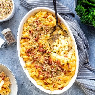 Baked macaroni and cheese with crumb topping in an oval baking dish