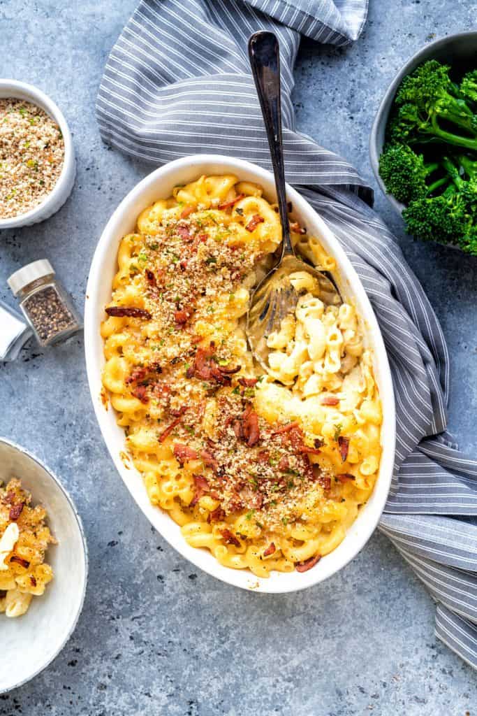Baked macaroni and cheese with crumb topping in an oval baking dish