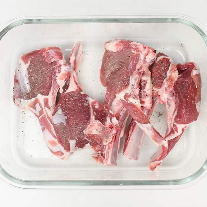 Lamb chops seasoned with salt and pepper