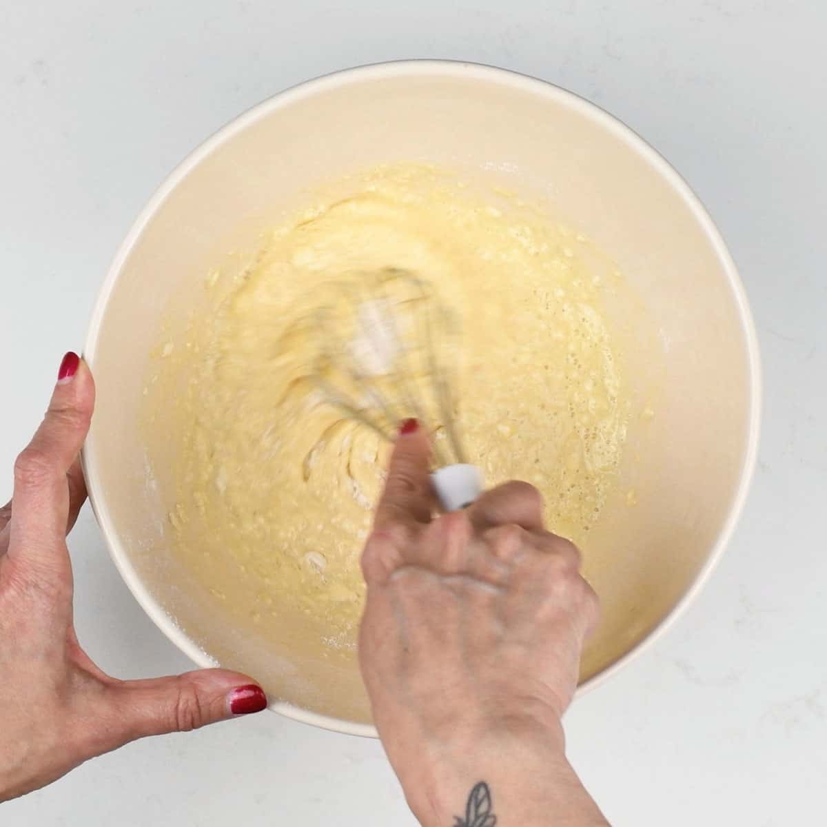 Mixing pancake batter with a balloon whisk
