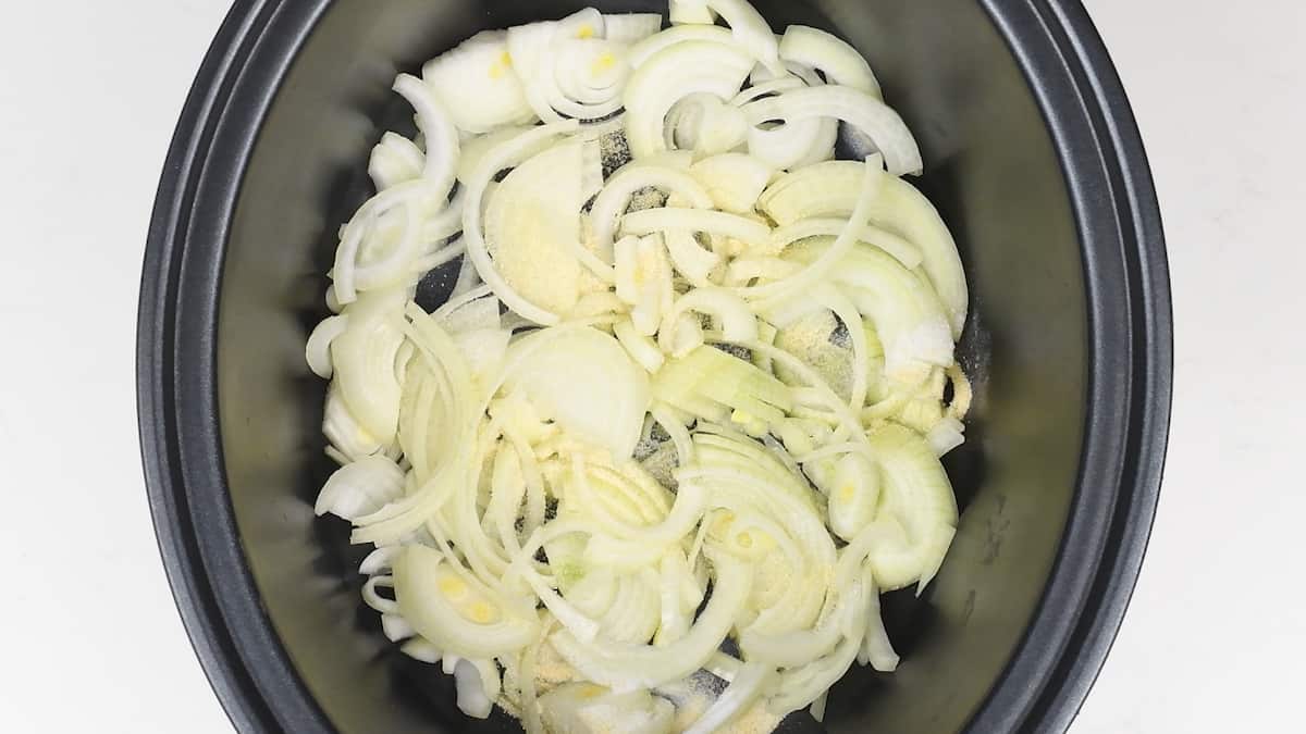 Sliced onions in a slow cooker