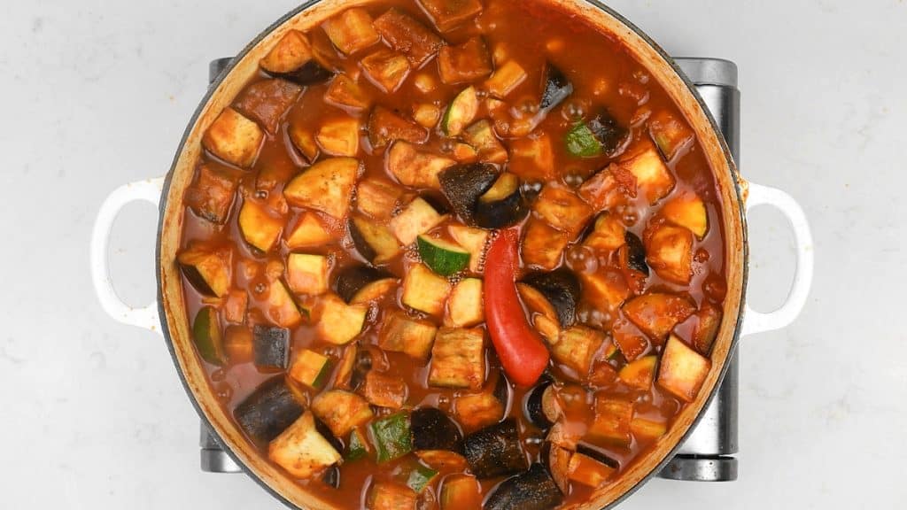 vegetable curry simmering in a casserole dish