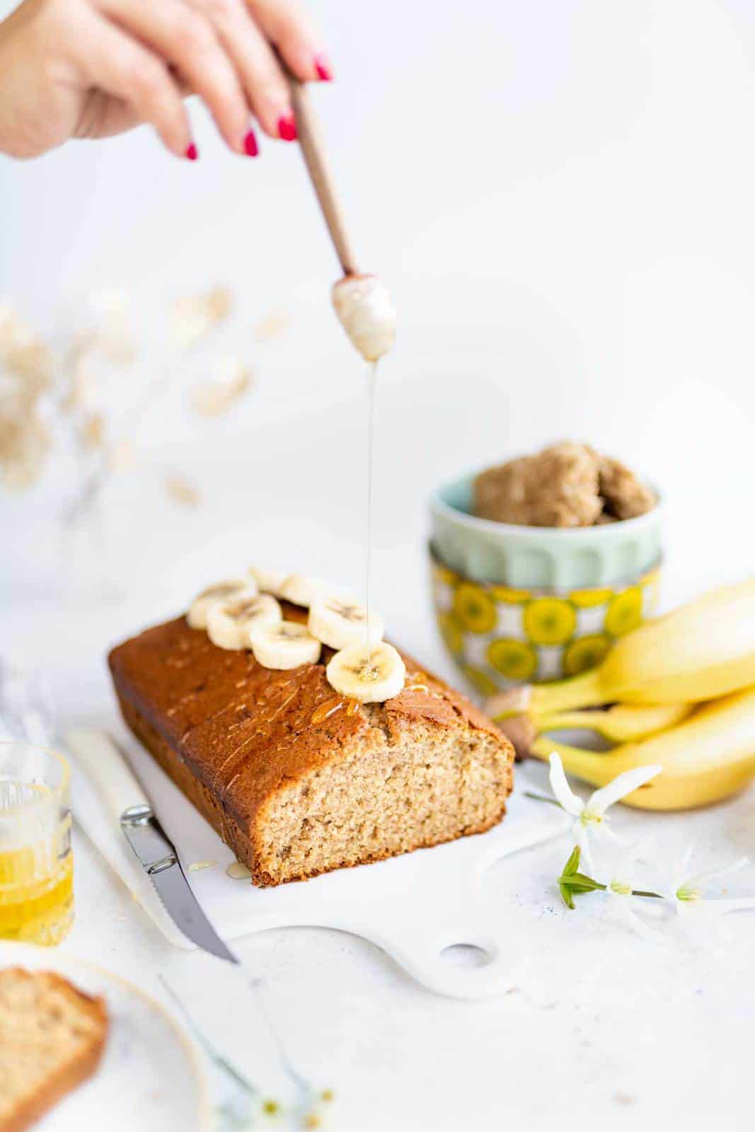 Drizzling banana loaf with honey