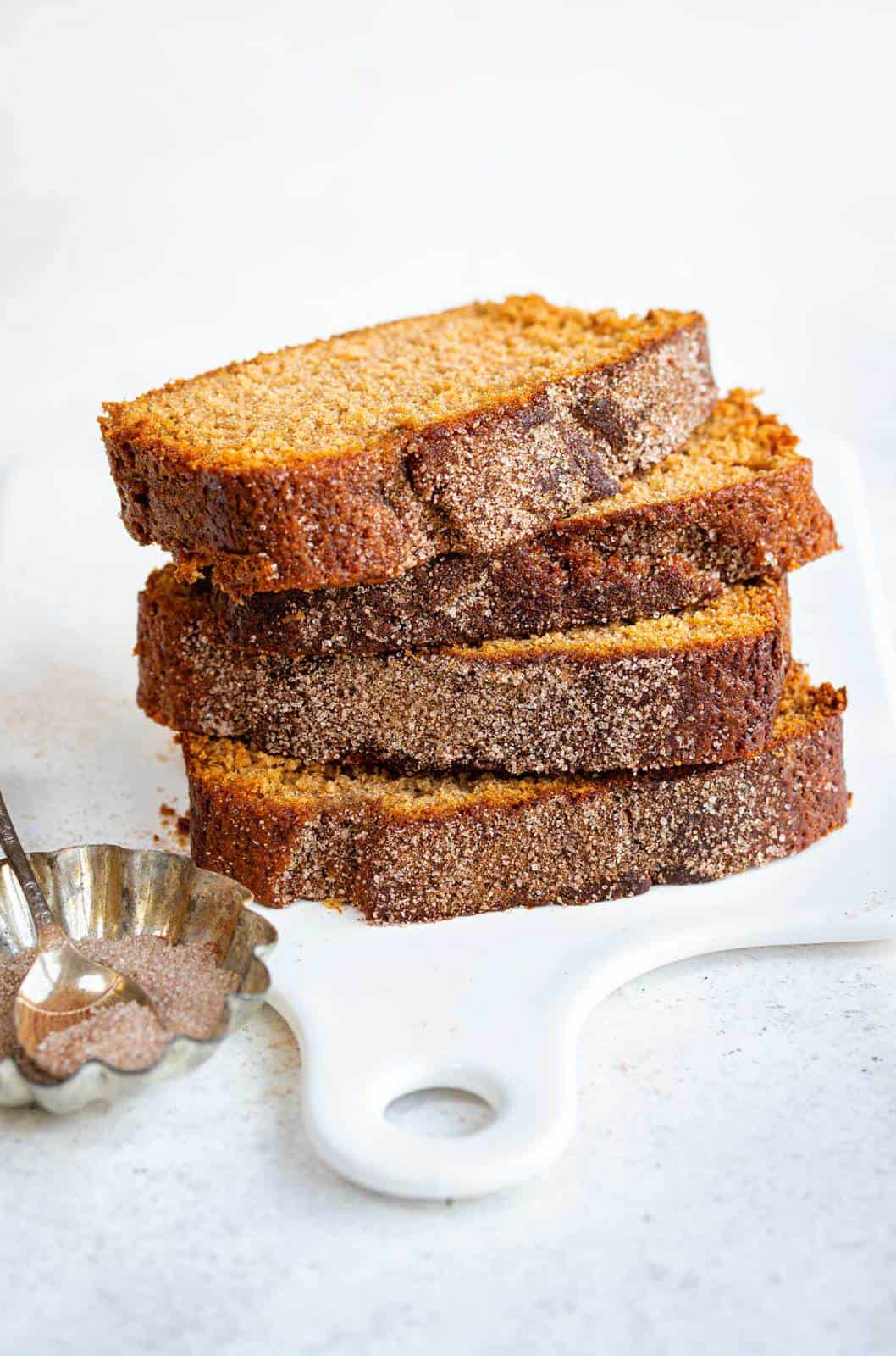 Slices of Apple Cinnamon Bread stacked on a platter