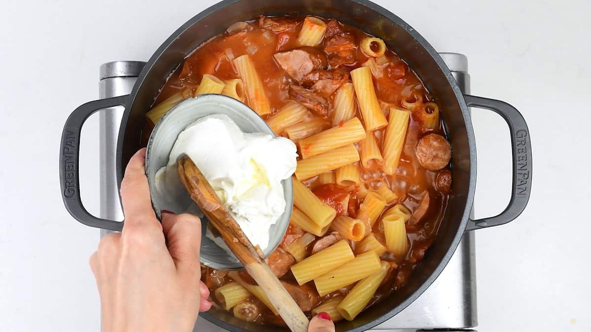 Adding mascarpone to spicy sausage pasta and sauce 