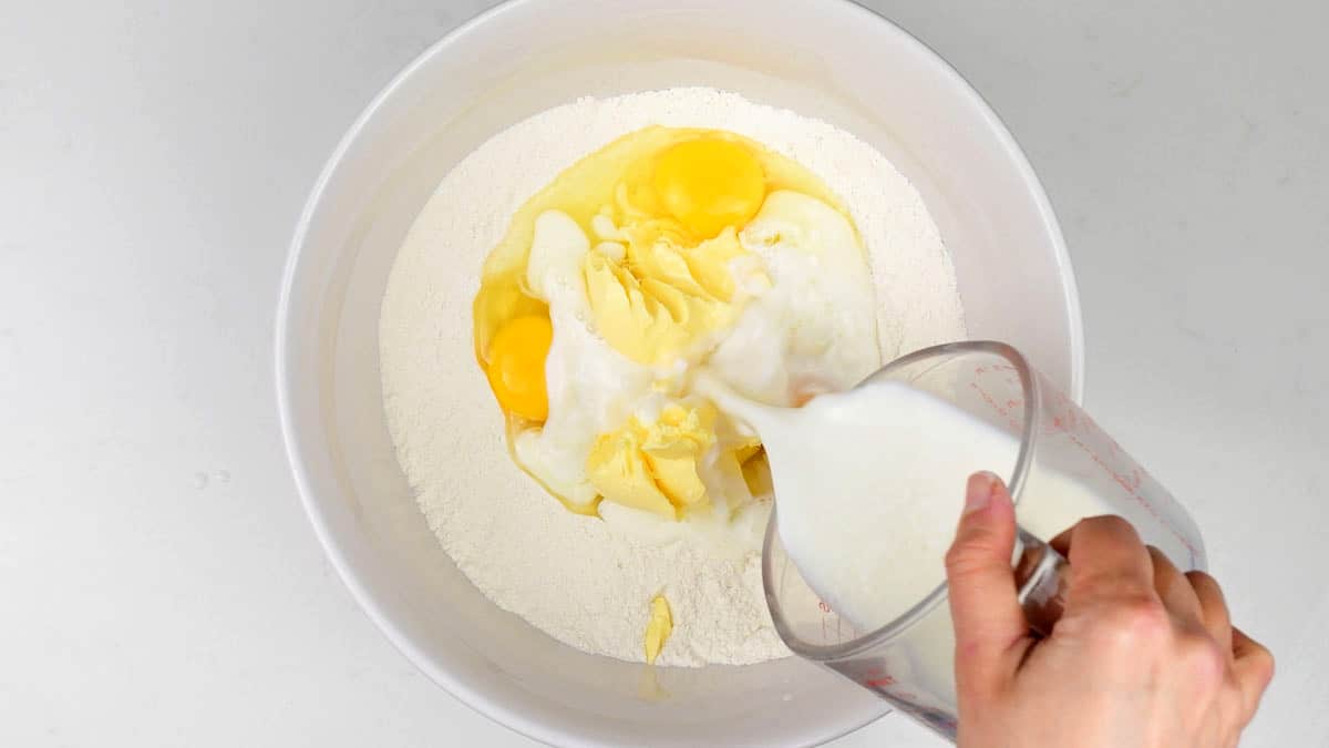flour, sugar, butter, eggs and milk in a large mixing bowl