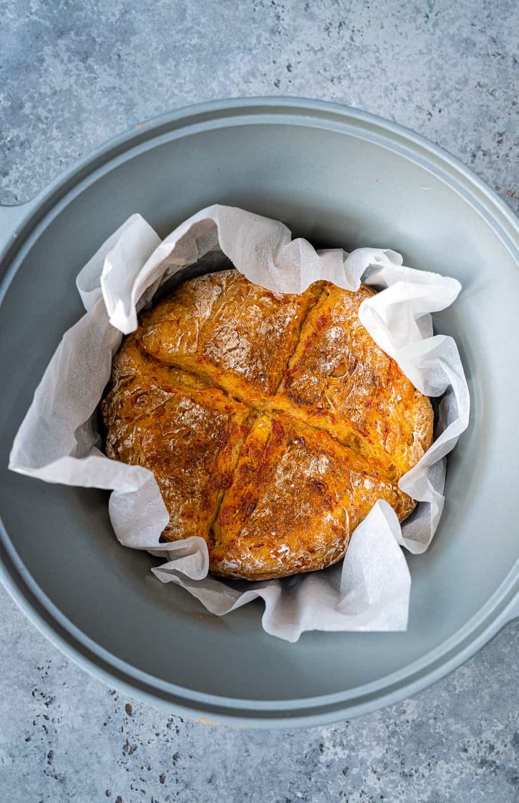 Slow cooker bread in a crockpot lined with baking paper 