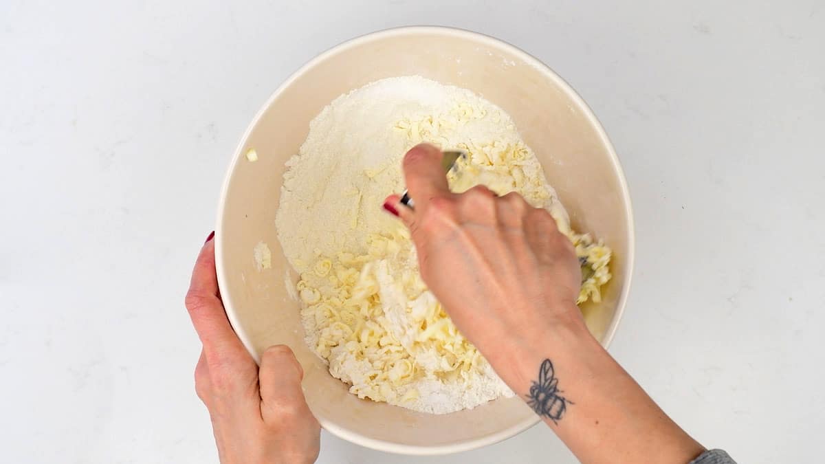 cutting cold butter into flour 