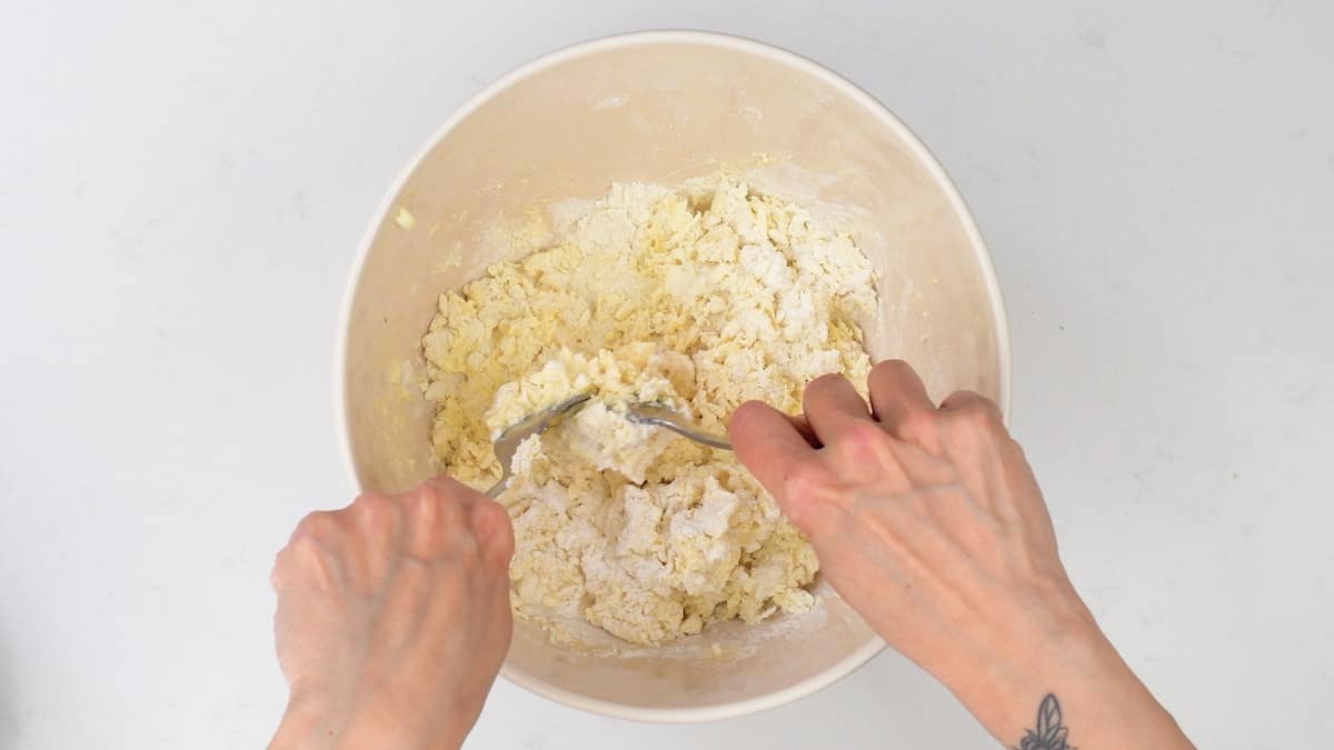 mixing scone dough using two forks