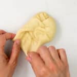 shaping dough into a ball